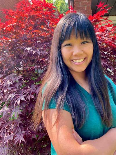 About me - Martha in front of red leaves About me - Martha in front of red leaves